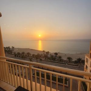 a view of the ocean from the balcony of a resort at Royal Beach in King Abdullah Economic City