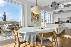 a kitchen and dining room with a table and chairs at 1053-Thisted-Kraenhavs-Sti-8 in Torsted +26 photos