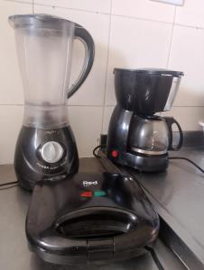 a blender sitting on top of a kitchen counter at Apartamento BEIRA MAR - Edifício Mar Del Plata in Itamaracá