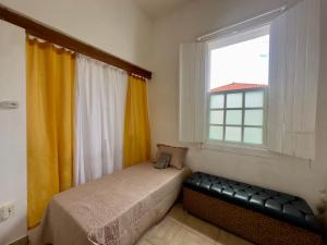 Giường trong phòng chung tại Casarão Centenário