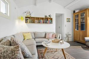 a living room with a couch and a table at 1309-Thisted-Blabaervej-2 in Thisted