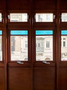 a group of three windows in a building at Speranza in Il-Gżira