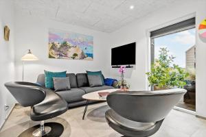 Et tv og/eller underholdning på 9929-Hvide-Sande-Langsand-194-stuen