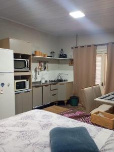 een keuken met een koelkast en een aanrechtblad bij net kit for 4 people in Torres