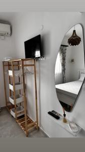 a room with a mirror and a bunk bed at Yasemin Pansiyon Plus in Seferihisar