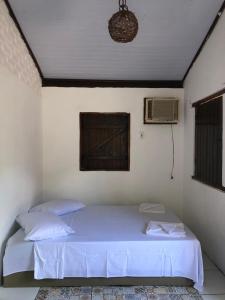 En eller flere senge i et værelse på Potyra Guest House