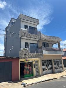 a building with a store on a street at Pôr do Sol - Serraruna in Araruna