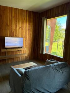 Et tv og/eller underholdning på Cabañas Cuatro Estaciones Frutillar Bajo