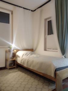 En eller flere senge i et værelse på Blue apartment