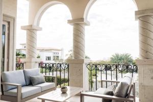 a living room with a couch on a balcony at Luxury Villa Retreat, Pool in Cabo San Lucas