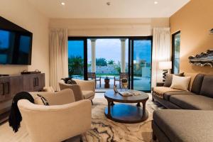 a living room with couches and a coffee table at Luxury Villa Retreat, Pool in Cabo San Lucas