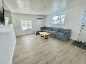 a living room with a couch and a table at Bogachiel Den in Forks