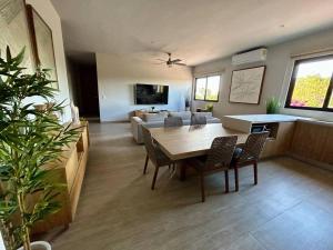 a living room with a table and a couch at CASA 1111 SMALL in Mazatlán