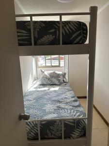 En eller flere senge i et værelse på condominio azul 1