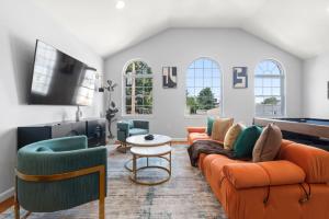 a living room with couches and a pool table at Modern 3BR Near NYC with Pool Table Sleeps 11 in Jersey City
