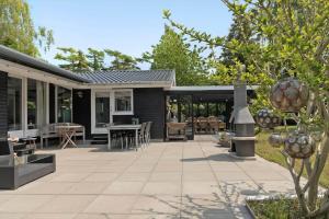 an outdoor patio with a table and chairs at 3006-Stege-Bunden-6 in Stege