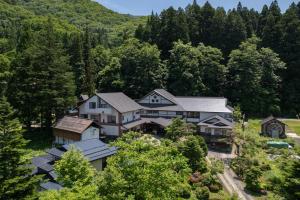 an aerial view of a house in the woods at ShirabuOnsen Higashiya in Yonezawa