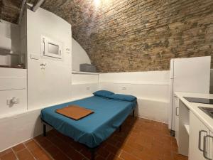 En eller flere senge i et værelse på La Casa di Alissia a Brescia