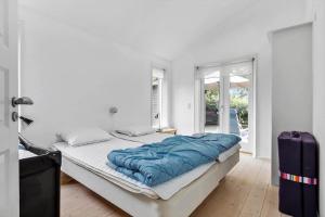 Postel nebo postele na pokoji v ubytování 8148-Praesto-Anemonevej-8