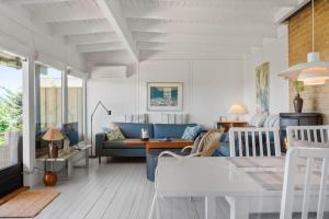 a living room with a couch and a table at 8220-Vordingborg-Solbaervej-6 in Vordingborg