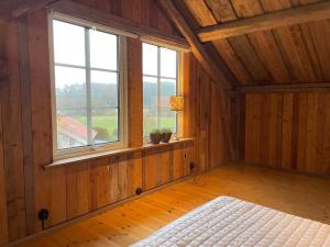 En eller flere senge i et værelse på 4 star holiday home in UDDEVALLA