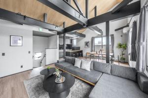 a living room with a couch and a table at Hoshiyado Higashikawa in Higashikawa +97 photos