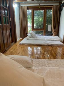 En eller flere senge i et værelse på Chiềng Đi Dreamy