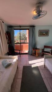 En eller flere senge i et værelse på Habitación en Condominio Terrazas del Sol