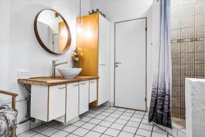 a bathroom with a sink and a mirror at OH185-Hadsund-Sommerland-39 in Hadsund +16 photos