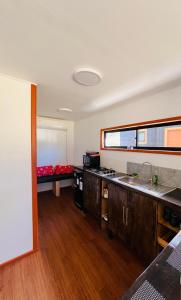 a kitchen with a sink and a counter top at Oro y Miel in Callaqui