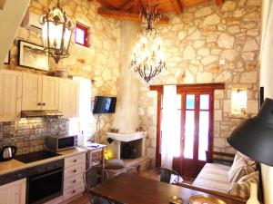 A kitchen or kitchenette at Alegria Villas Complex