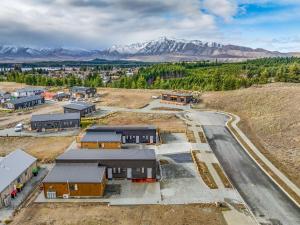 an aerial view of a village with mountains in the background at Sunshine Suites in Lake Tekapo