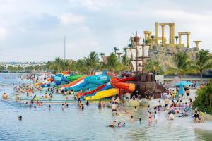 a group of people in the water at a water park at Timi Homestay Near the Wave Park Ocean Park 2 in Hòa Bình