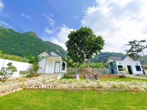 a house with a garden in front of it at Mộc Châu House in Mộc Châu