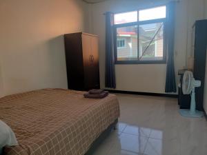 En eller flere senge i et værelse på Soi Saliga