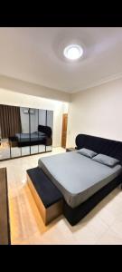 a bedroom with a large bed in a room at عماره 11 in 6th Of October