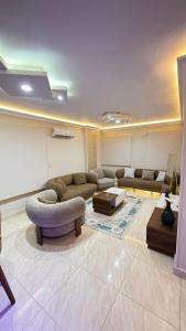 a living room with a couch and a table at عماره 11 in 6th Of October
