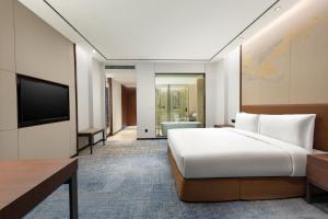 TV/trung tâm giải trí tại HUALUXE Qidong