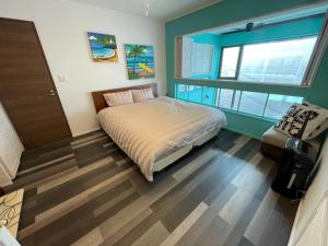 Postel nebo postele na pokoji v ubytování 葉山THE TERRACE HOUSE