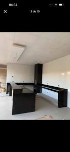 an empty room with a black desk in it at Casa bosque in São Paulo