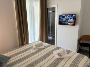 En eller flere senge i et værelse på unit_type_semidetached_house Umag 55102