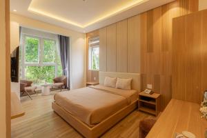 Postel nebo postele na pokoji v ubytování An Mai Boutique Hotel