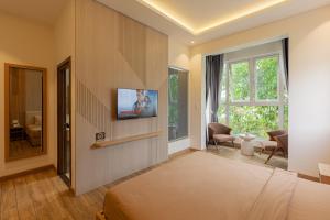 TV a/nebo společenská místnost v ubytování An Mai Boutique Hotel