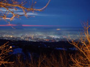 a view of a city at night at Secluded Cabins with Mountain & Sunset Views in Almaty +46 photos