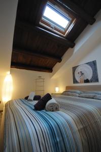 Postel nebo postele na pokoji v ubytování Papireto 11 Loft