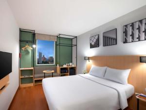 En eller flere senge i et værelse på Ibis Bangkok Sukhumvit 4