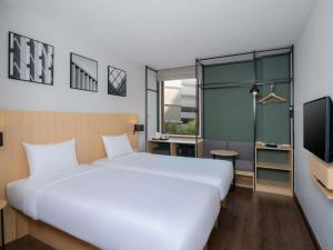 En eller flere senge i et værelse på Ibis Bangkok Sukhumvit 4