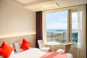 Postel nebo postele na pokoji v ubytování Shin Shin Hotel Jeju Worldcup + 56 fotografií