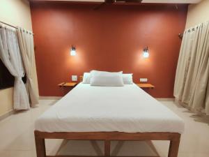 En eller flere senge i et værelse på Nature yatra