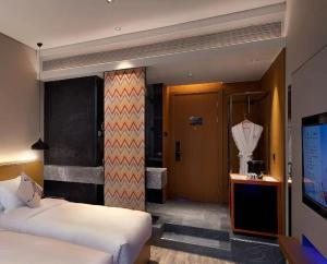 TV a/nebo společenská místnost v ubytování Sofitel Fuzhou Pop Hotel + 18 fotografií